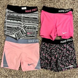 Nike Pro girls medium. $15 for all 4 pairs.